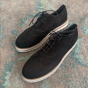 Black oxford wingtip shoes